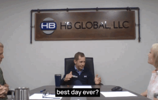 A photo of Bob, Stacy, and Adam sitting around a conference room table for the podcast.