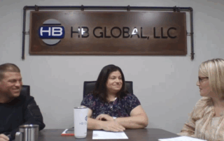 An image of Bob, Stacy, and Tabatha sitting at a conference room table recording the podcast.