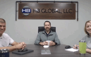 A photo of Bob, Jon, and Stacy in a conference room recording the podcast.